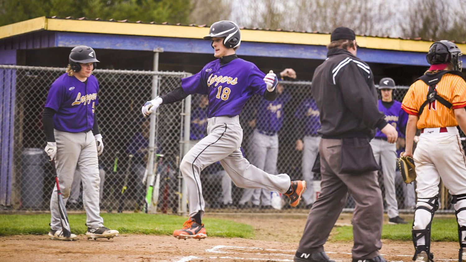 Onalaska's Lethon Fitch scores a run during a home game against Winlock on March 31.